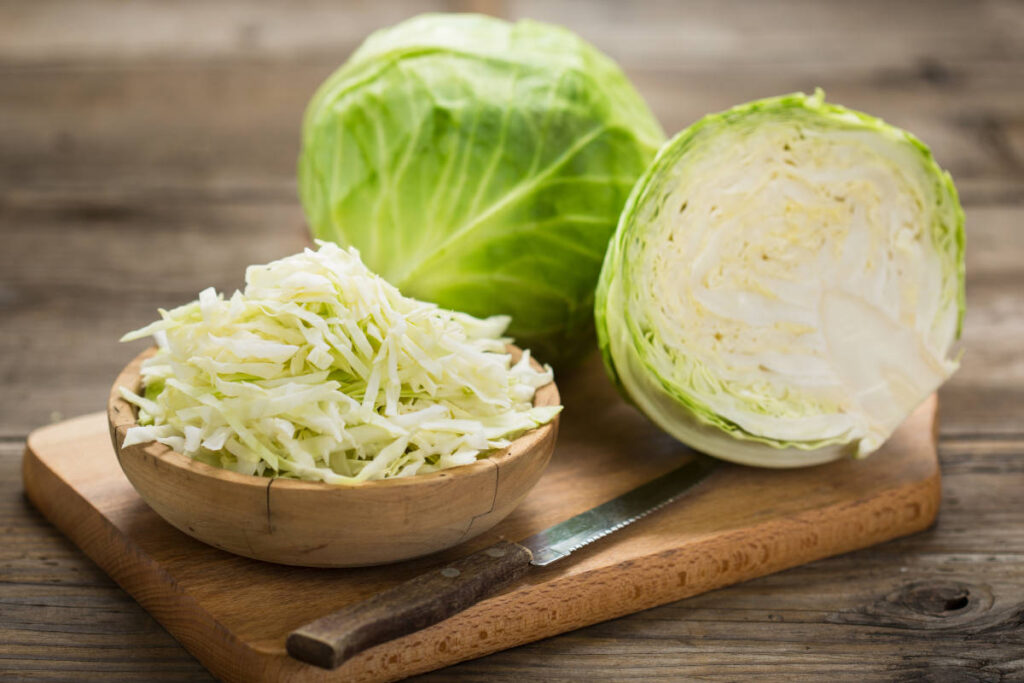 Cabbage on a wooden cutting board and table, astringent