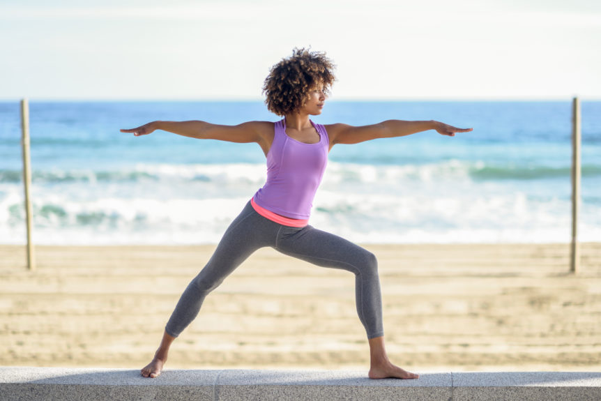 Women performing yoga and using adaptogens for workout endurance and recovery.