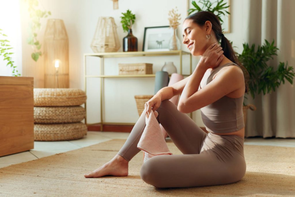 Woman doing a abhyanga practice for self-care