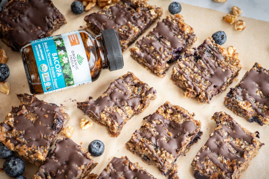 Bacopa bars with blueberries on parchment paper