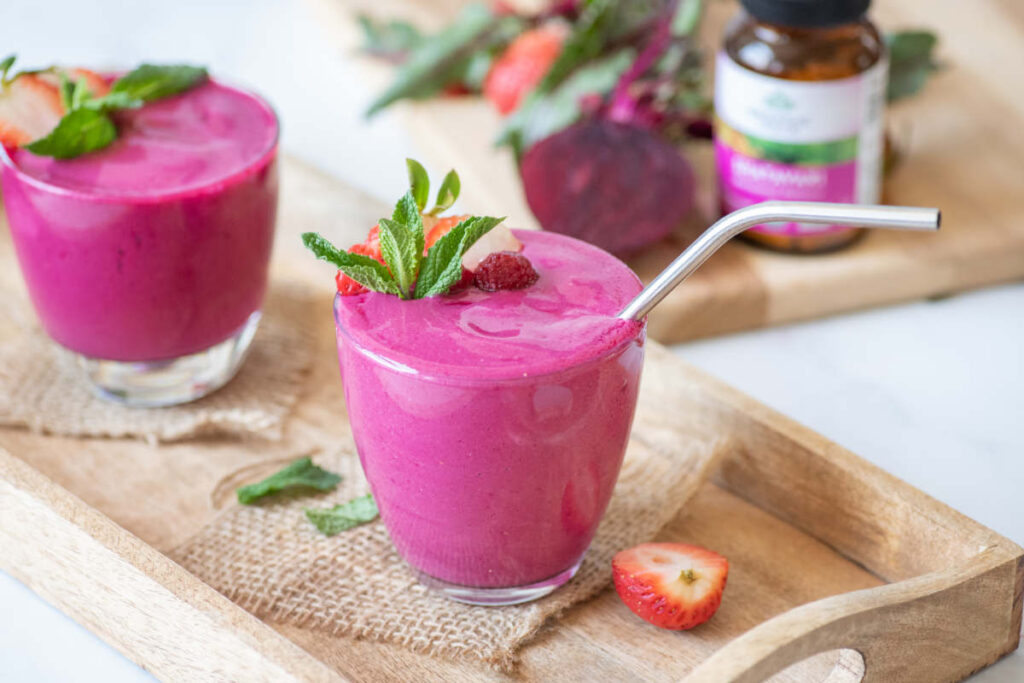 Vibrant magenta beet vegan smoothie recipes in clear glass