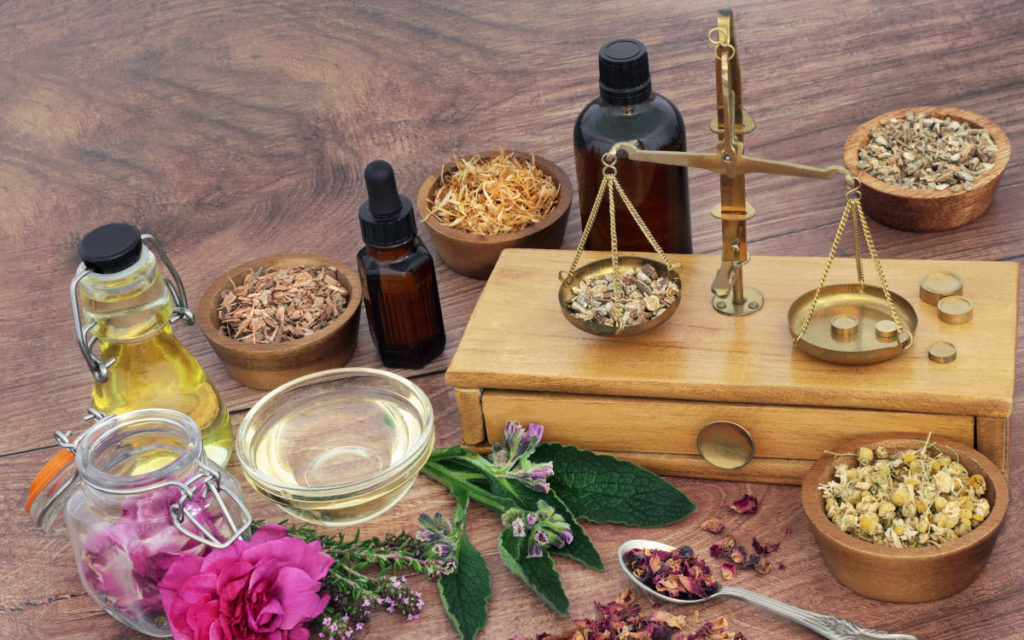Weights, stems, flowers and leaves for herbal pairings for health.