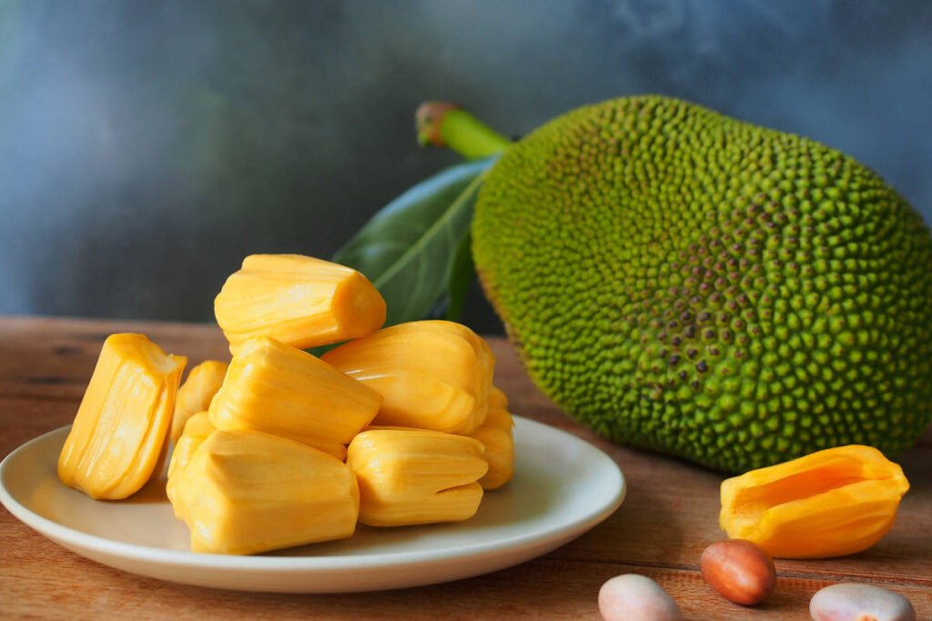 Indian superfood jackfruit whole and sliced on plate