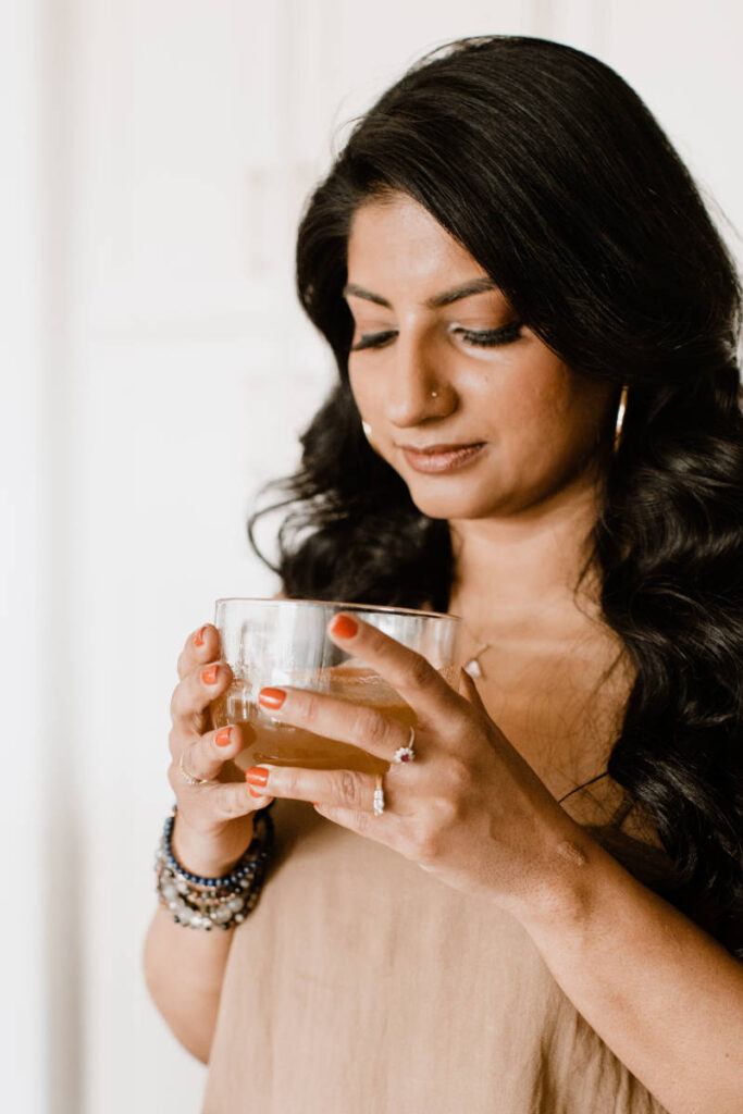 Radhika Mukhija, Women's Coach and Mentor, drinking tea.