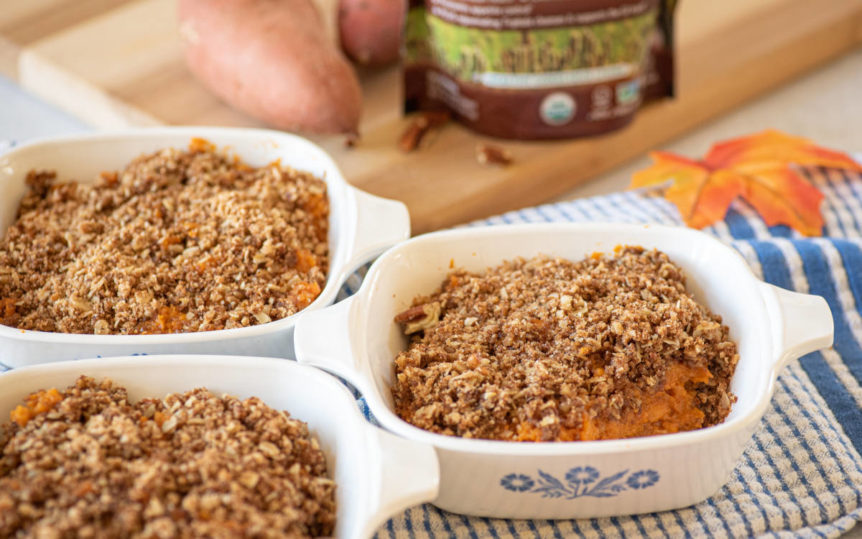 3 white oven-safe dishes featuring sweet potato casserole with cinnamon topping.