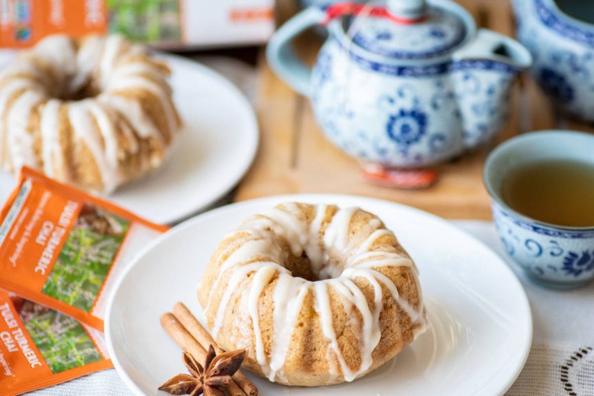 Ultimate tea pairings, chai tea in decorative tea pot and sweet tea cakes on white plate