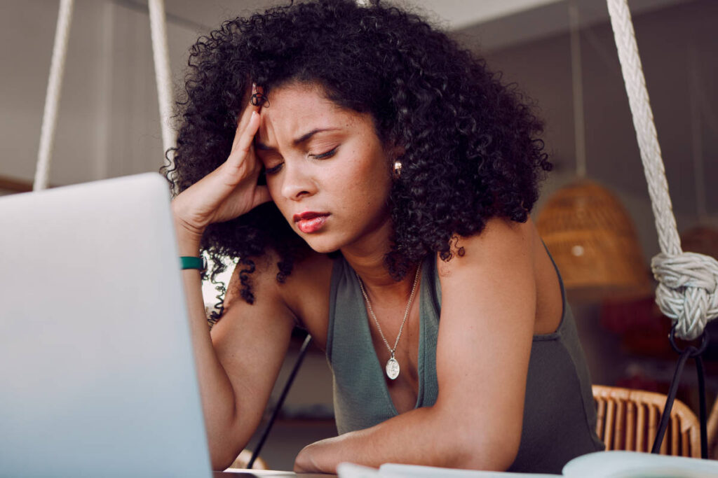 Woman stressed at work understanding 5 stages of burnout 